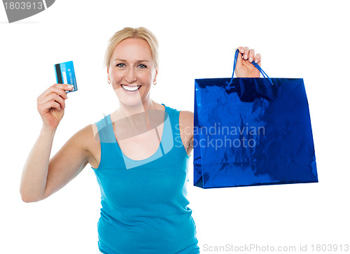 Image of Shopper woman holding bag and credit card