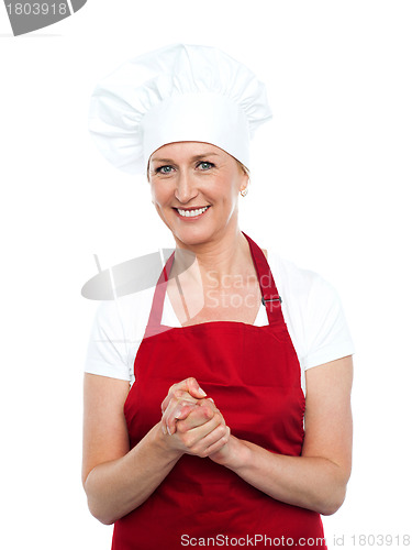 Image of Beautiful female cook looking at you