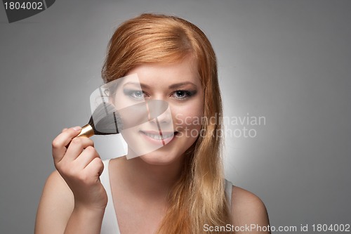 Image of Girl does a make-up