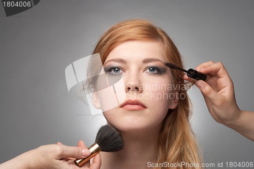 Image of Girl does a make-up