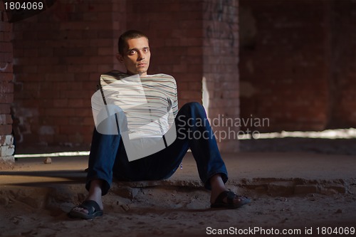 Image of Thoughtful man sitting