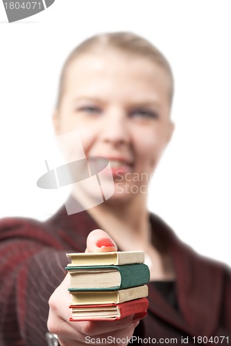 Image of Young businesswoman with books