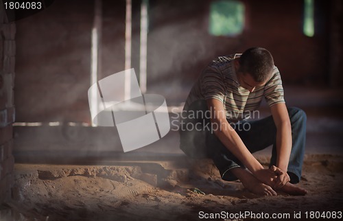 Image of Thoughtful man sitting