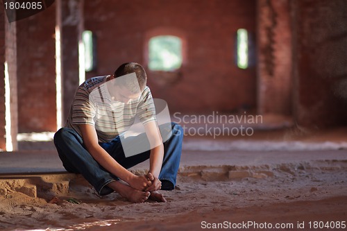 Image of Thoughtful man sitting