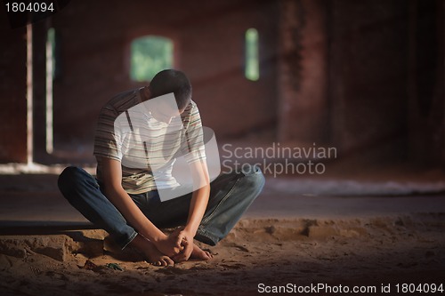 Image of Thoughtful man sitting