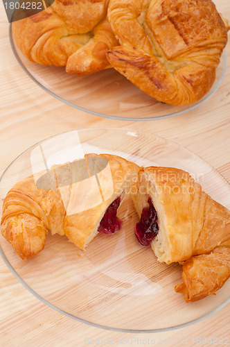 Image of croissant French brioche filled with berries jam