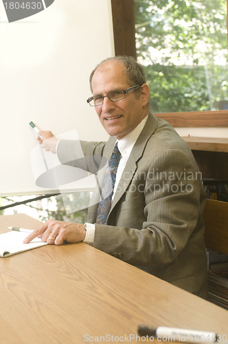 Image of senior business executuve in conference office giving presentati