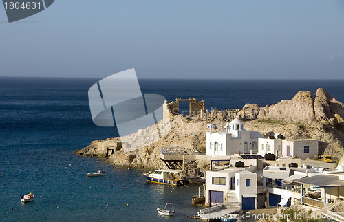 Image of houses built into rock cliffs on Mediterranean Sea Firopotamos M