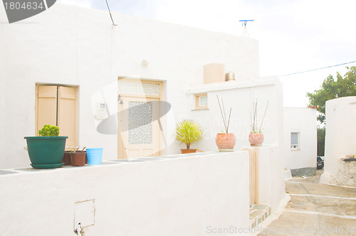 Image of street scene typical architecture Milos Cyclades Greek Island Gr