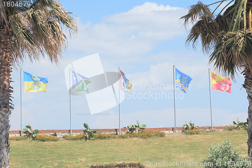 Image of Different flags row.on  windsurfing station in Alacati, Turkey