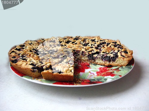 Image of Fresh pie with bilberry on the white background