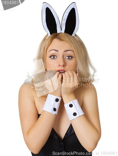 Image of Frightened young girl in rabbit costume isolated on white