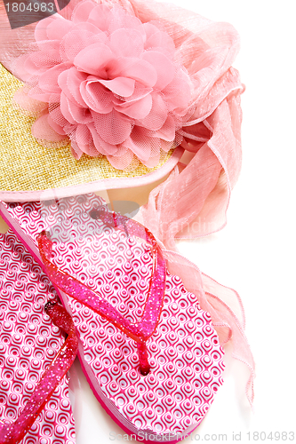 Image of Summer sandals and a straw hat and veil.