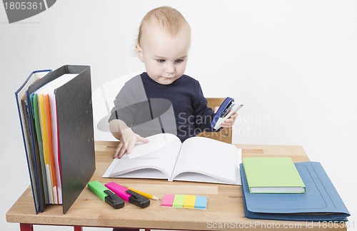 Image of young child at writing desk