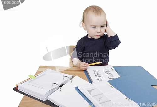 Image of young child at writing desk