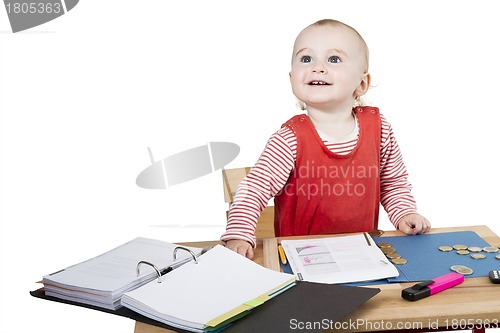 Image of young child at writing desk