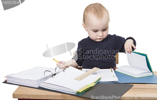 Image of young child at writing desk