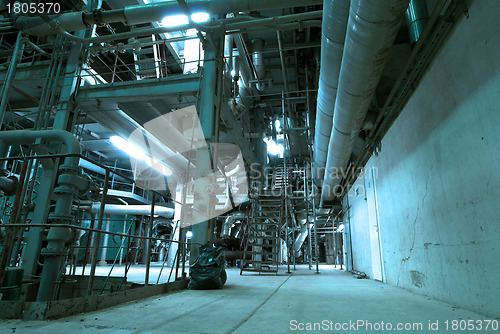 Image of Equipment, cables and piping as found inside of  industrial powe