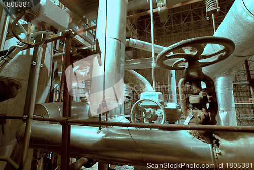 Image of Equipment, cables and piping as found inside of  industrial powe