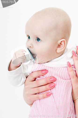 Image of baby girl with a pacifier