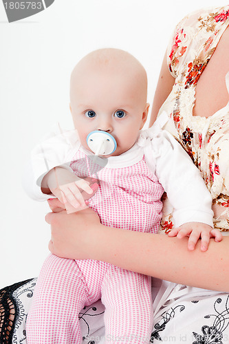 Image of baby girl with a pacifier