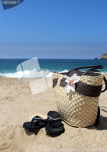 Image of Seacoast, straw beach bag and flip-flops