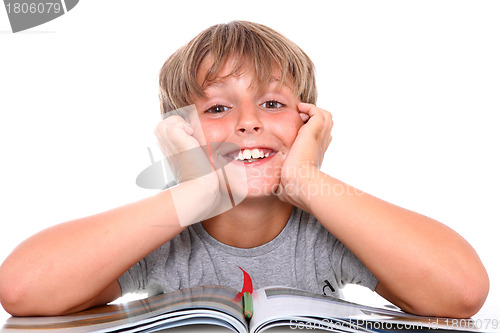 Image of Smiling schoolboy with book 