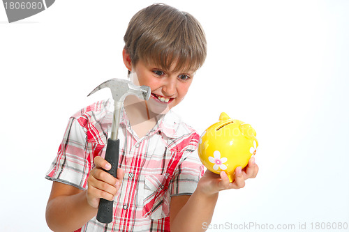 Image of boy with a hammer breaking a piggybank against white background 