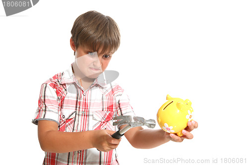 Image of boy with a hammer breaking a piggybank against white background