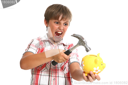 Image of boy with a hammer breaking a piggybank against white background