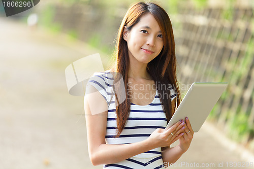 Image of woman using tablet computer
