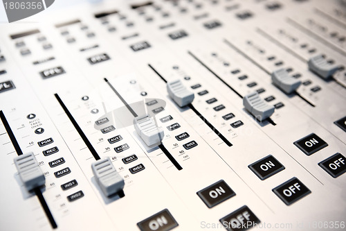 Image of controls of audio mixing console