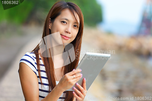 Image of woman using tablet computer