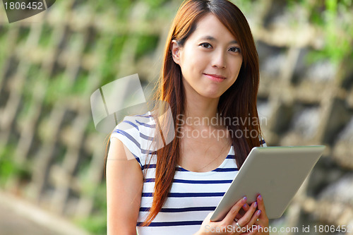 Image of woman using tablet computer