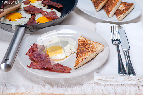Image of eggs bacon and toast bread