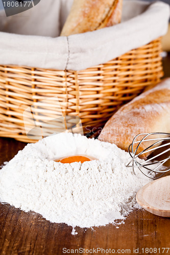 Image of read, flour, eggs and kitchen utensil