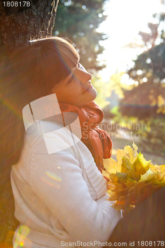 Image of woman in the autumn park 
