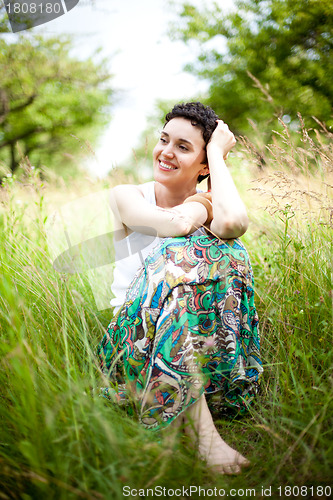 Image of girl resting on fresh spring grass 