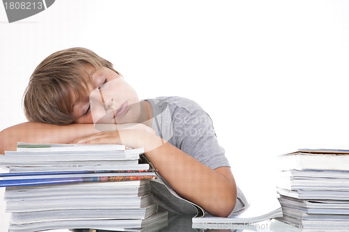 Image of Tired student at the desk, isolated on white 