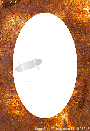 Image of Rusty tin background and white oval in center 