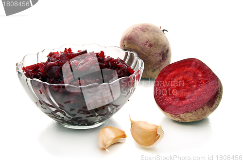 Image of Salad of roasted beets in glass salad bowl.