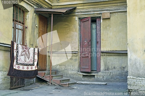 Image of Doorway to old apartment building in city outskirts