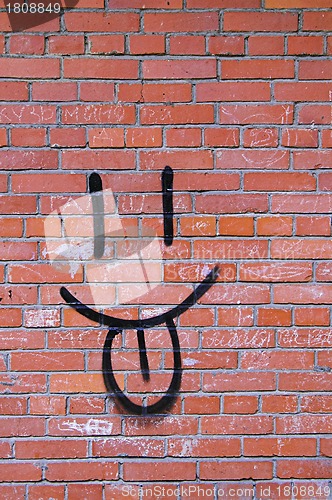 Image of Brick Wall and Smile Graffiti 