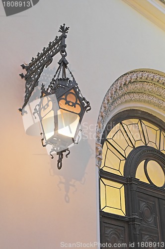 Image of Old lamp on cathedral's wall 