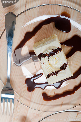 Image of fresh cream cake closeup with chocolate sauce