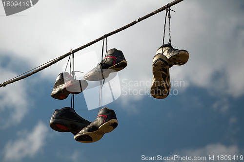 Image of Sneakers Hanging on a Telephone Line