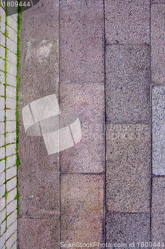 Image of Block wall and tiled path fragments background.