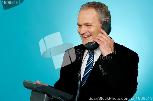 Image of Senior manager discussing deal with client