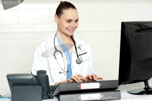 Image of Medical professional working on computer