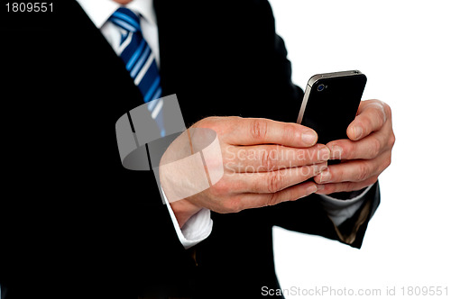 Image of Cropped image of a man sending message